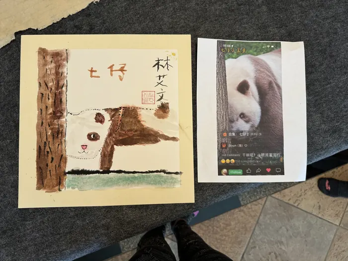 A panda painting beside its reference