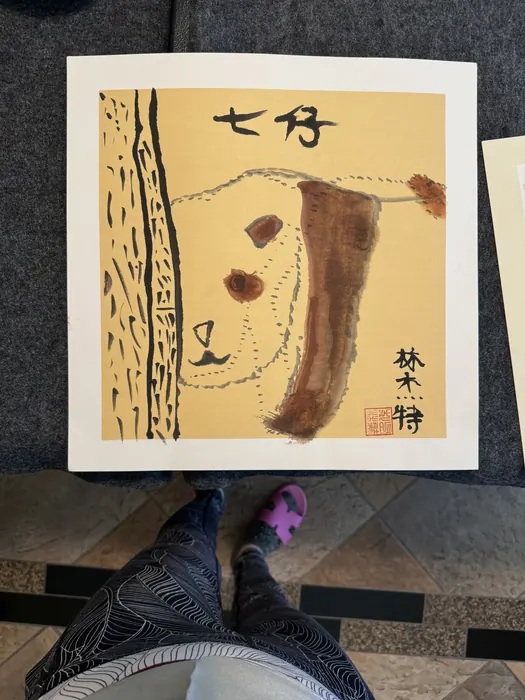 A panda study in ochre and ink