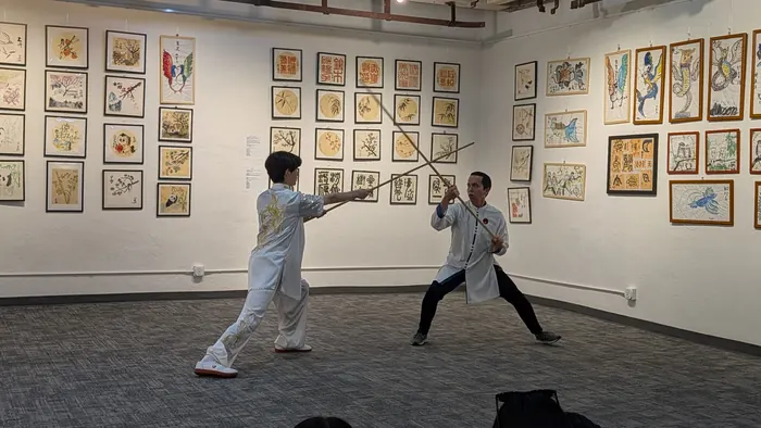Straight sword, held at distance