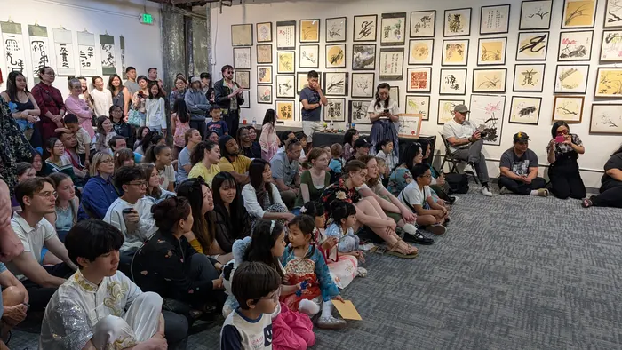 Families watching from the gallery floor