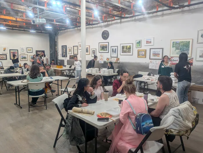 Families at the hands-on workshop tables