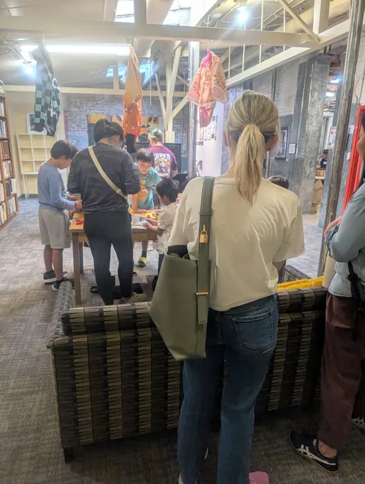 Visitors at the ink and brush table
