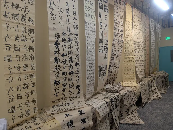 Calligraphy hung floor to ceiling