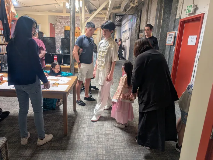 Trying on traditional costume