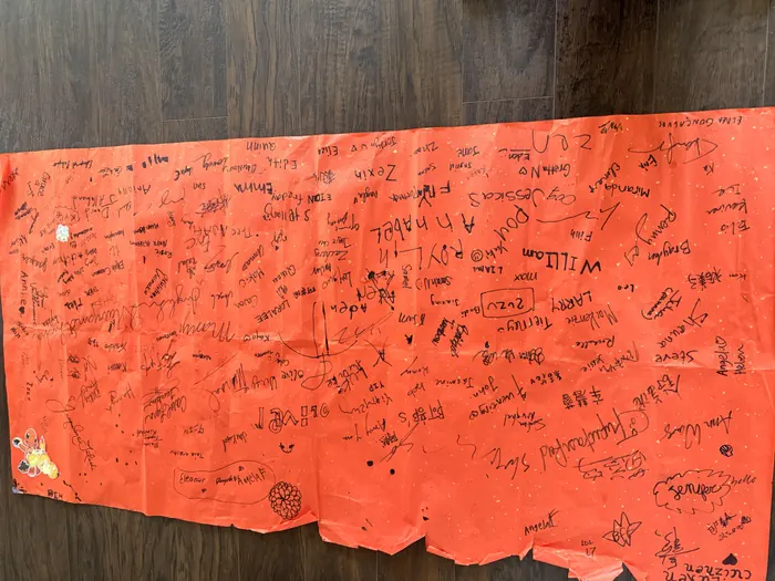 The signing banner, filling up through the day