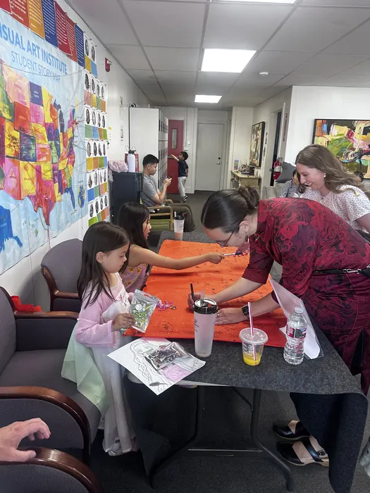 Painting at the family workshop table