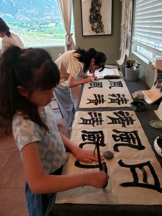 Young students practicing brushwork