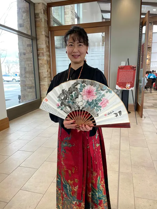 Presenting a hand-painted fan