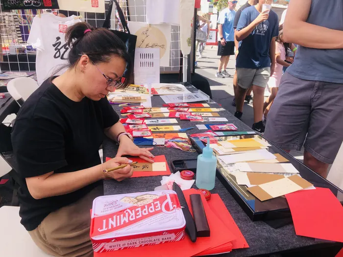 Hand-painting merchandise between customers