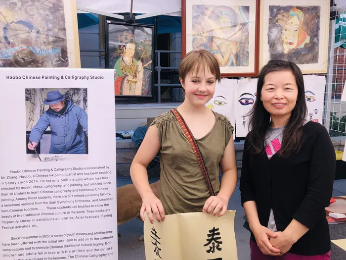 A visitor with her name written in Chinese calligraphy