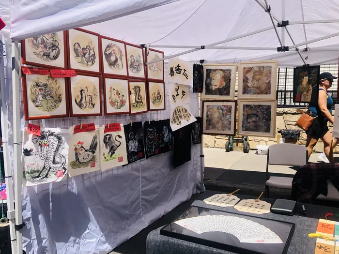 Framed work covering the booth walls