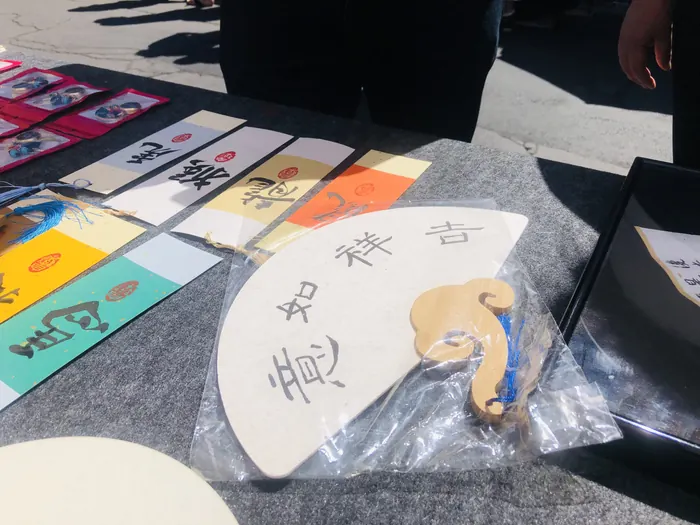 A hand-painted fan ready to go home with someone