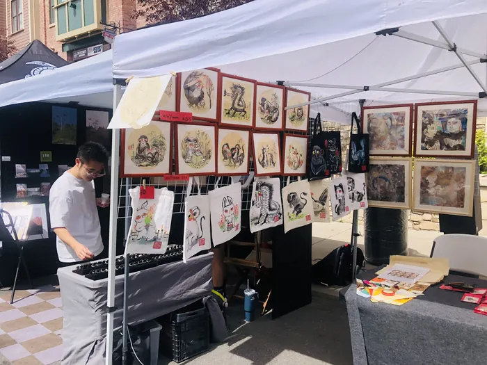 Working at the booth between visitors