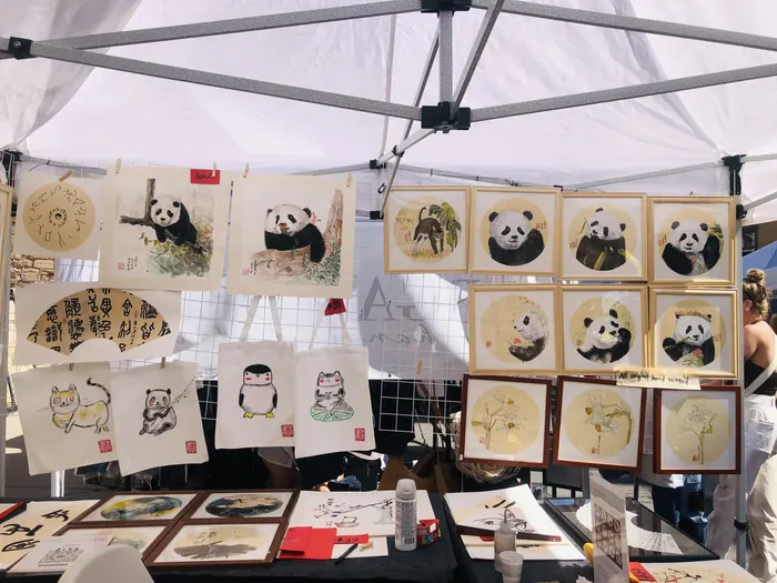 Panda paintings, the booth's signature subject